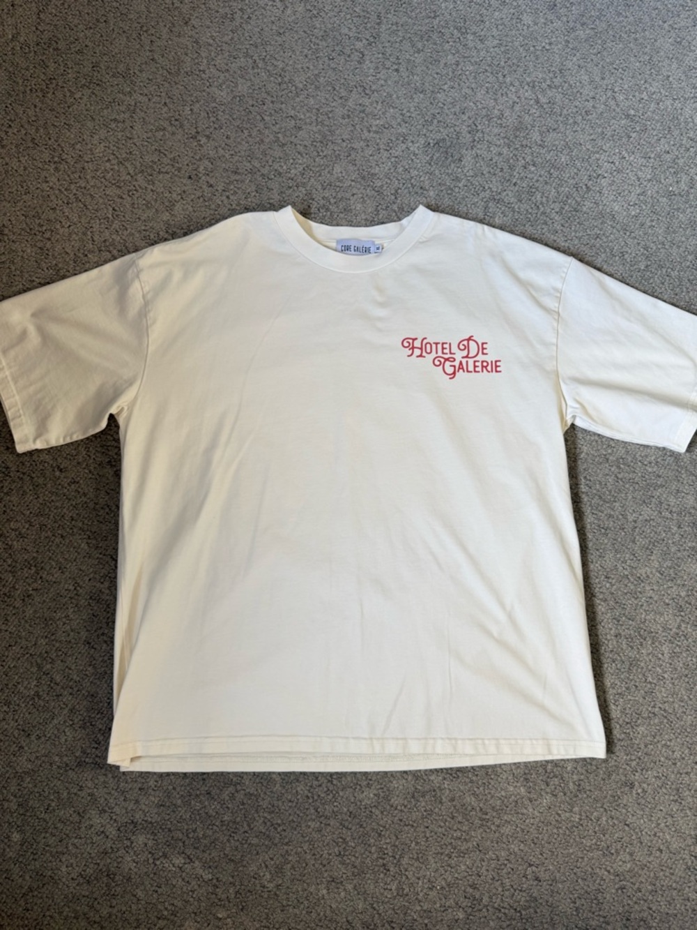 Hotel De Galerie Cream Graphic Tee with Red Logo - Men’s XL
